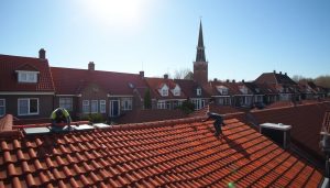 Dakpannen leggen Huizen